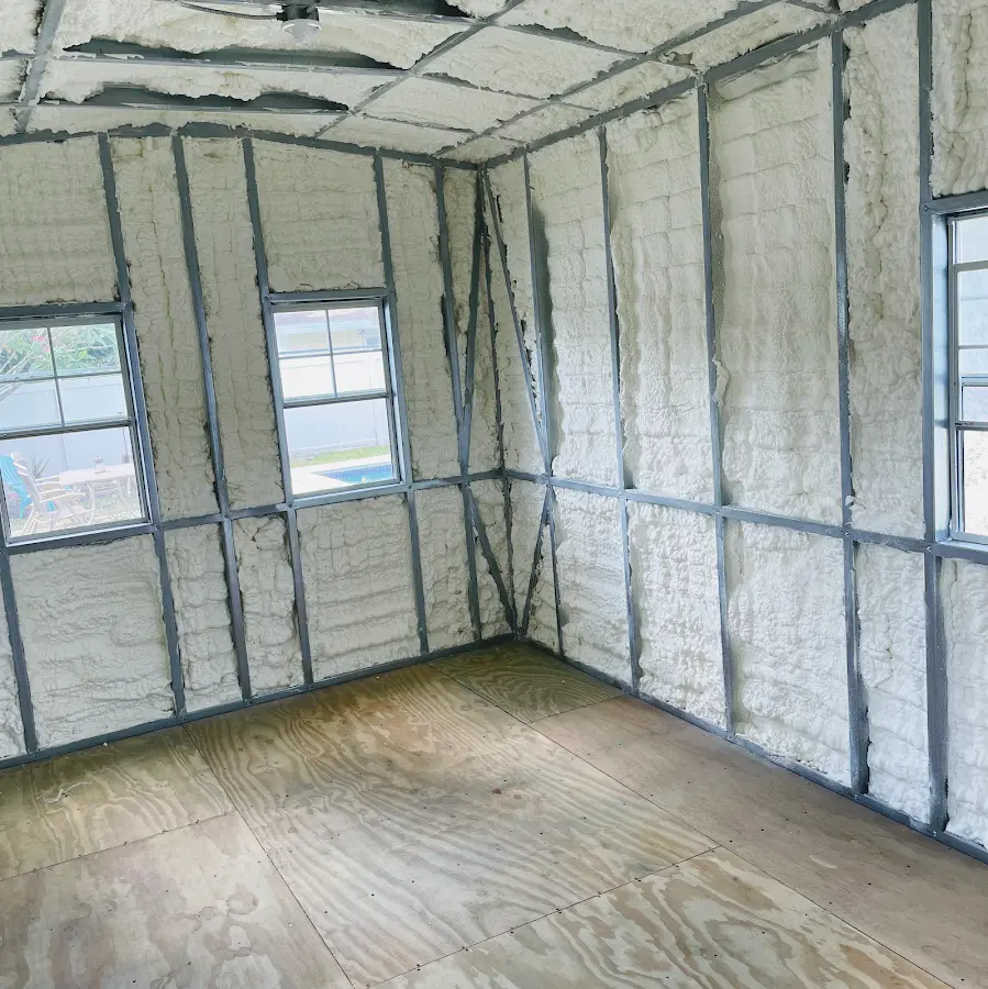 Closed-cell spray foam insulation applied to wall cavities in a residential project in Joliet